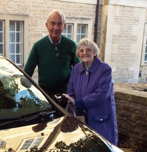 Man and woman next to a car