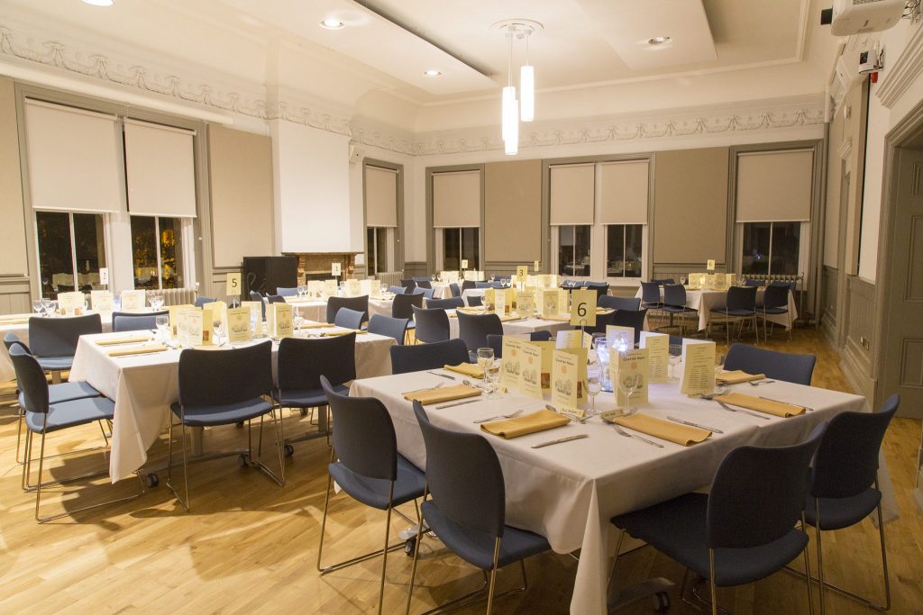 Council Chamber with tables prepared for dinner