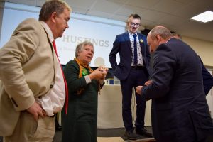 Mayor talking to parliamentary candidates at the Frome Hustings 