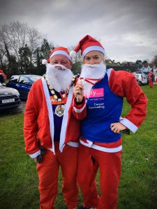 Mayor of Frome, Mark Dorrington, with Sergeant Rachel Clark, at the Frome Santa Dash in December 2019