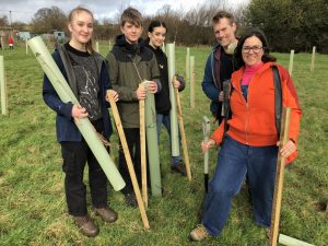 Photo of group of people ready to plant trees