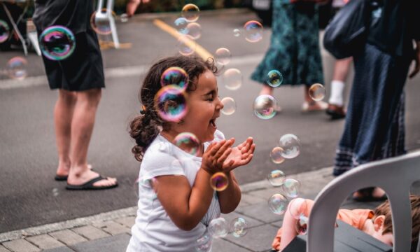 Child playing with bubbles 