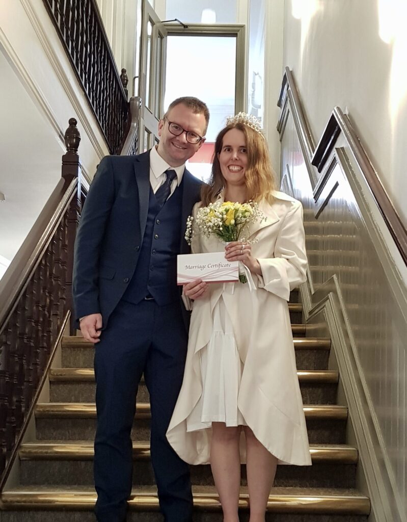 Married couple on stairs at the Town Hall