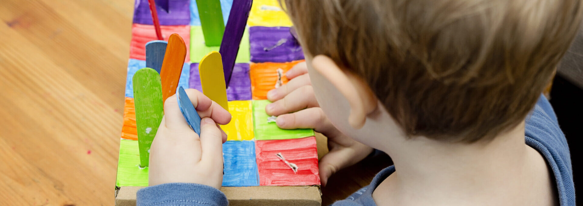 cardboard box and ice-cream sticks.