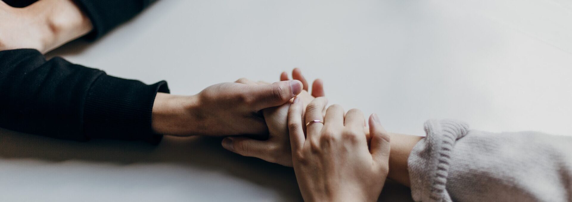 Holding hands across a table