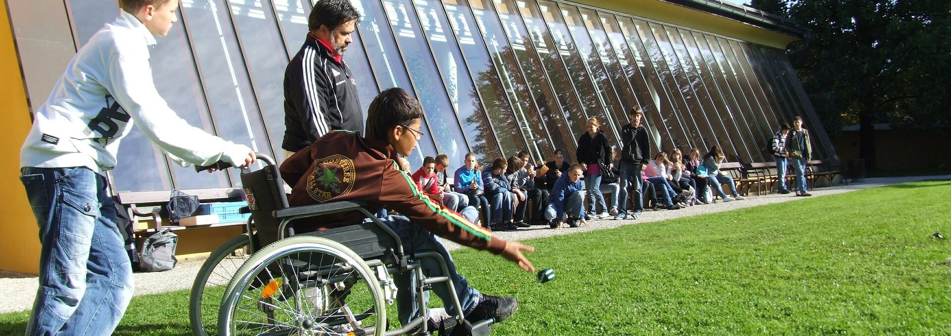 Boy in wheelchair playing bowls