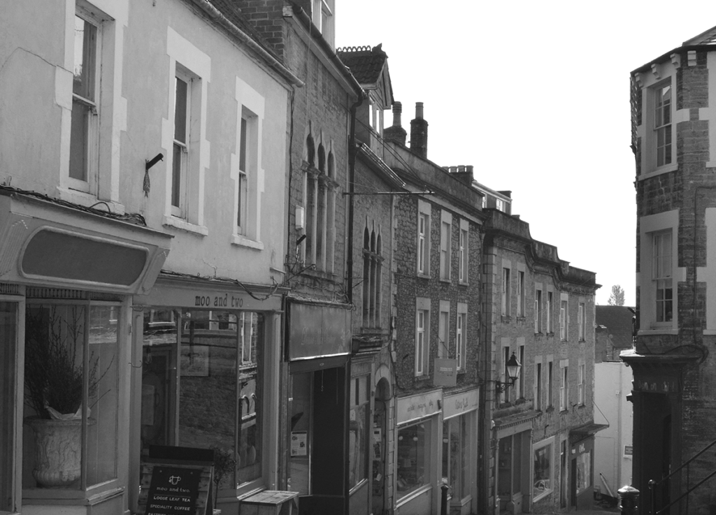 A black and white picture looking down at various shops from the top of Catherine Hill