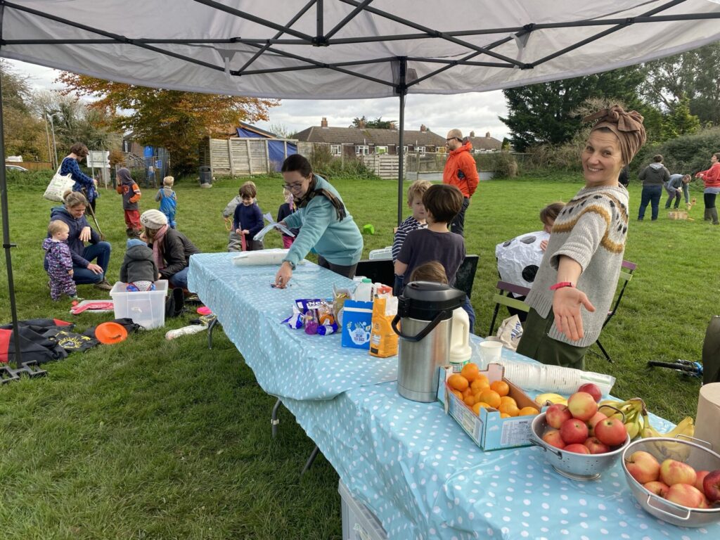 People preparing refreshments at community event