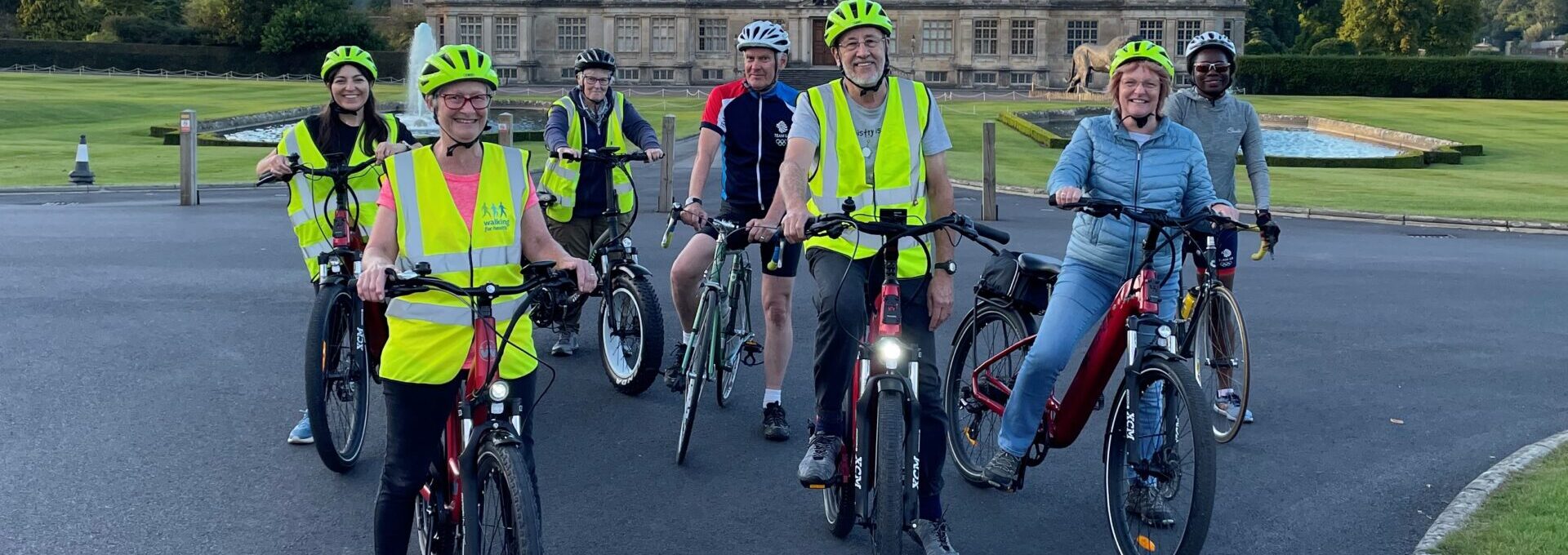 group of people on bikes outside longleat