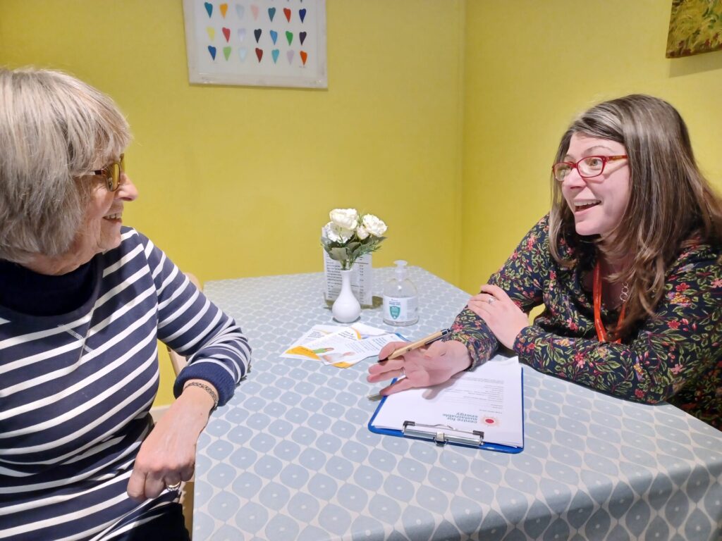 Two women talking across a table