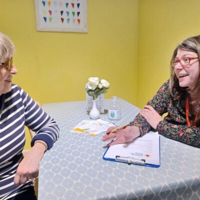 Two women talking across a table