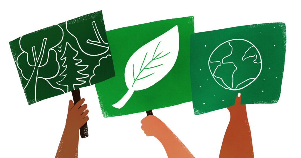 Three cartoon protesters holding green banners depicting a forest, a leaf and planet earth