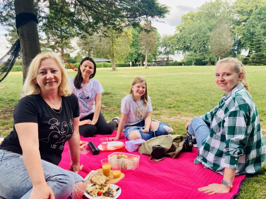 Photo of 4 people at the Frome refugee picnic event