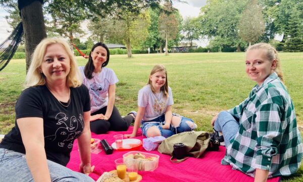 Photo of 4 people at the Frome refugee picnic event
