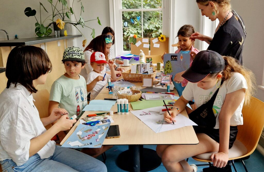 Families taking part in arts and crafts session at Frome Welcome Hub