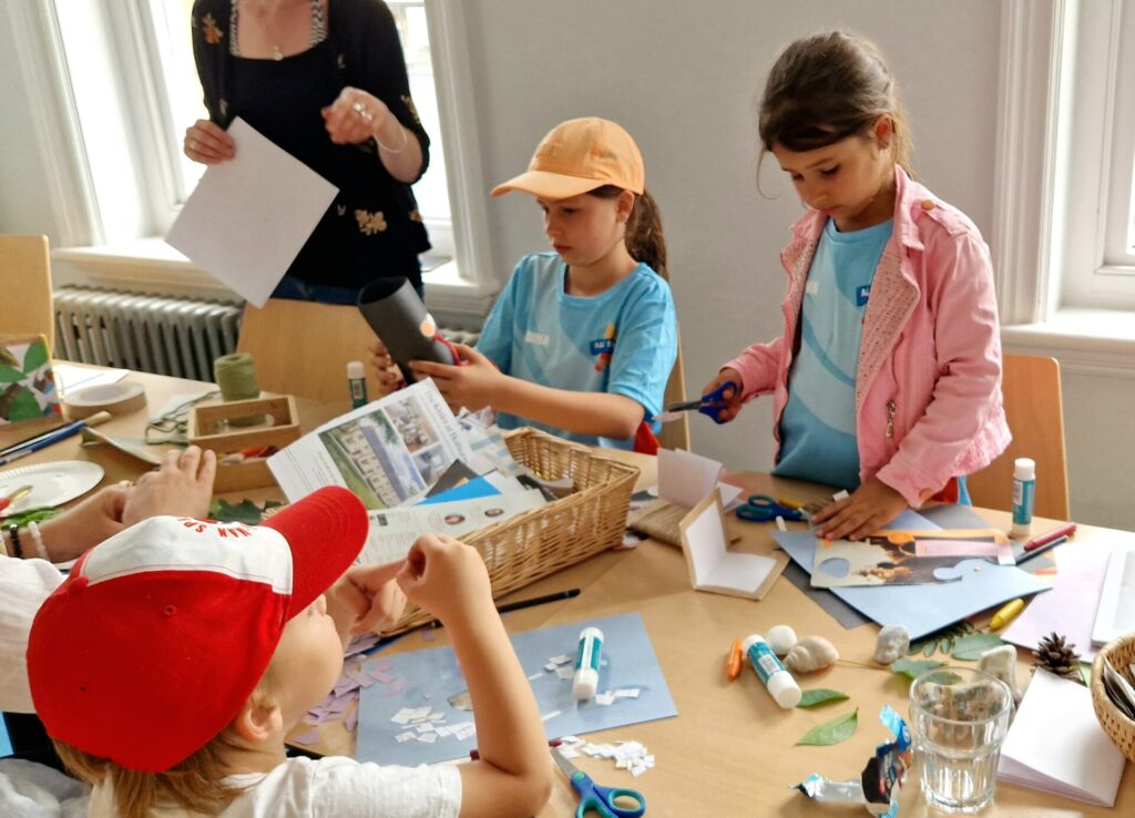 Children doing arts and crafts at Frome Welcome Hub