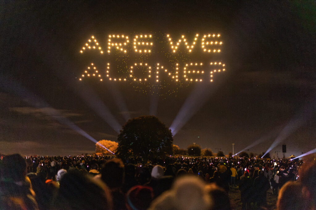 Drone display spelling out 'Are We Alone?' 