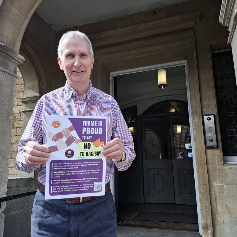 Peter Wheelhouse with the ARC anti-racist Charter on the town hall steps