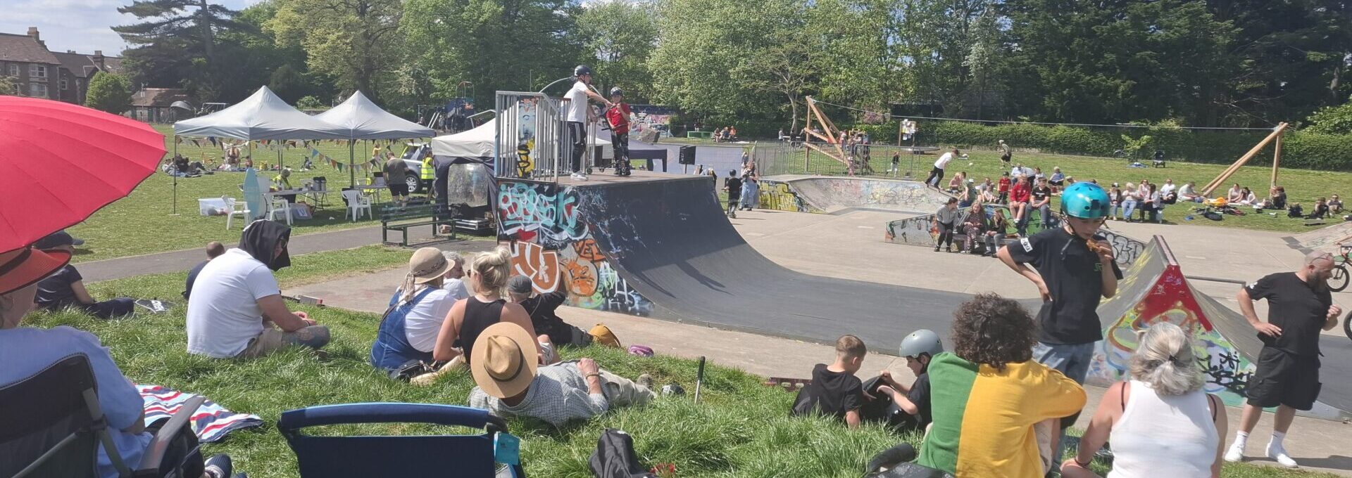 People looking at skaters at the Skatepark